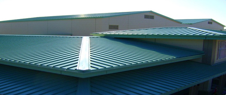 A long green Colorbond roof running the length of a large shed building